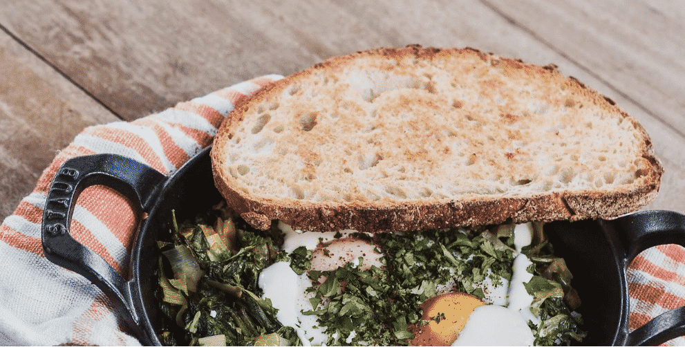 Alt Text: eggs and toast in cast iron skillet