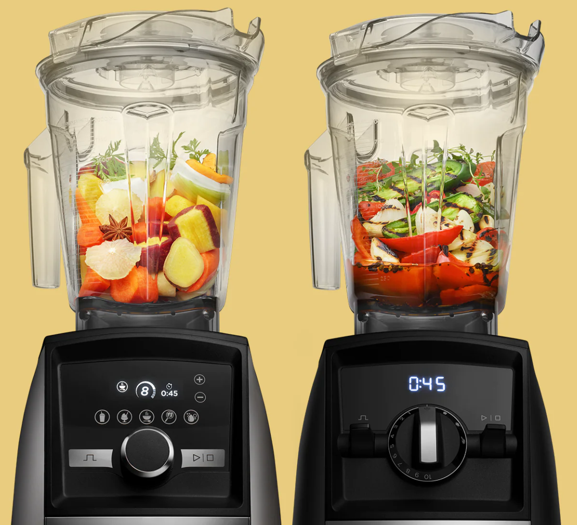 two vitamix blenders beside each other and blending fruit